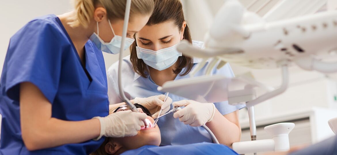 Female,Dentists,Treating,Patient,Girl,Teeth