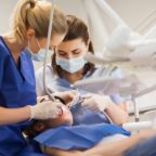 female dentists treating patient girl teeth