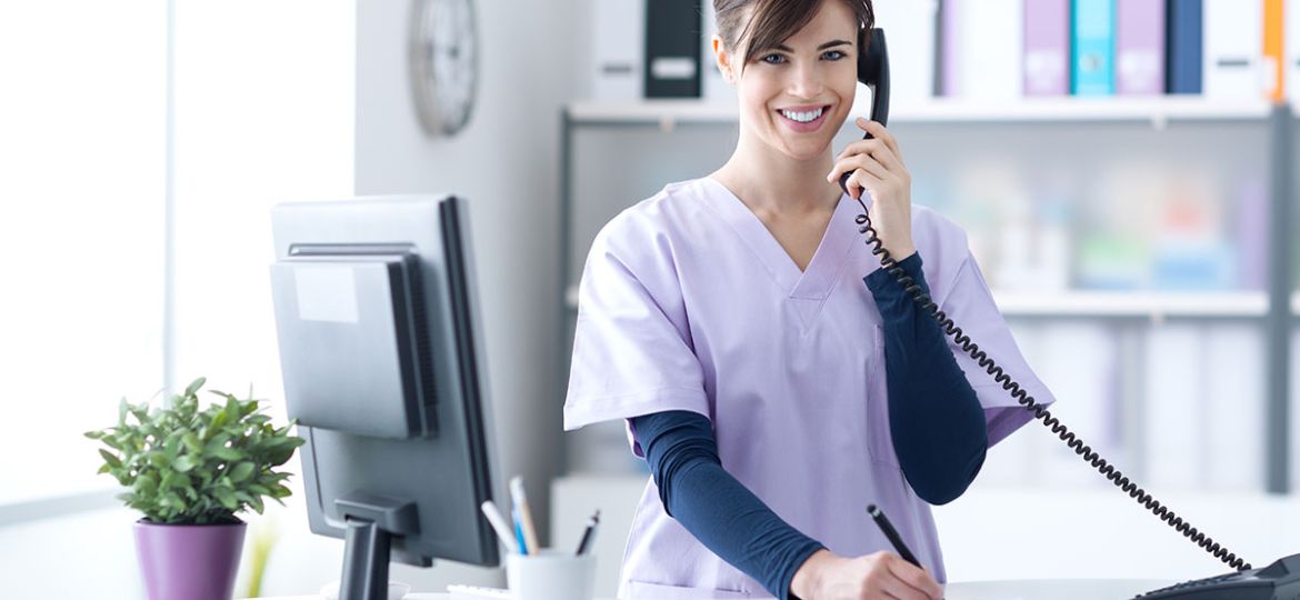 Young,Practitioner,Doctor,Working,At,The,Clinic,Reception,Desk,,She